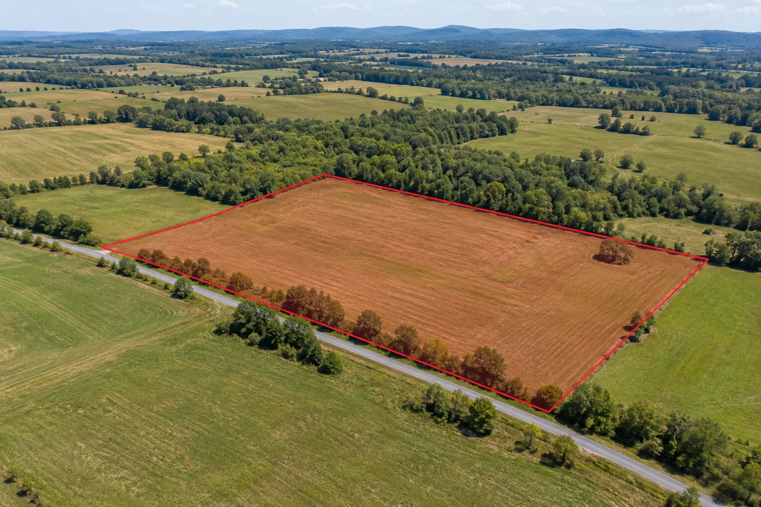AI-generated land illustration with a red example boundary, not a photograph of this transaction’s parcel