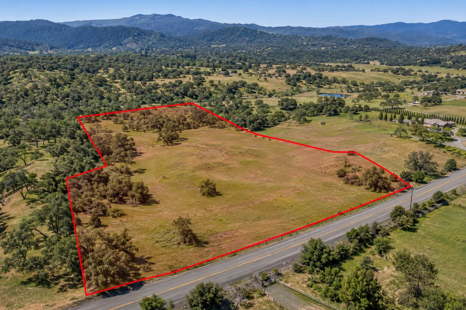 AI-generated land illustration with a red example boundary, not a photograph of this transaction’s parcel